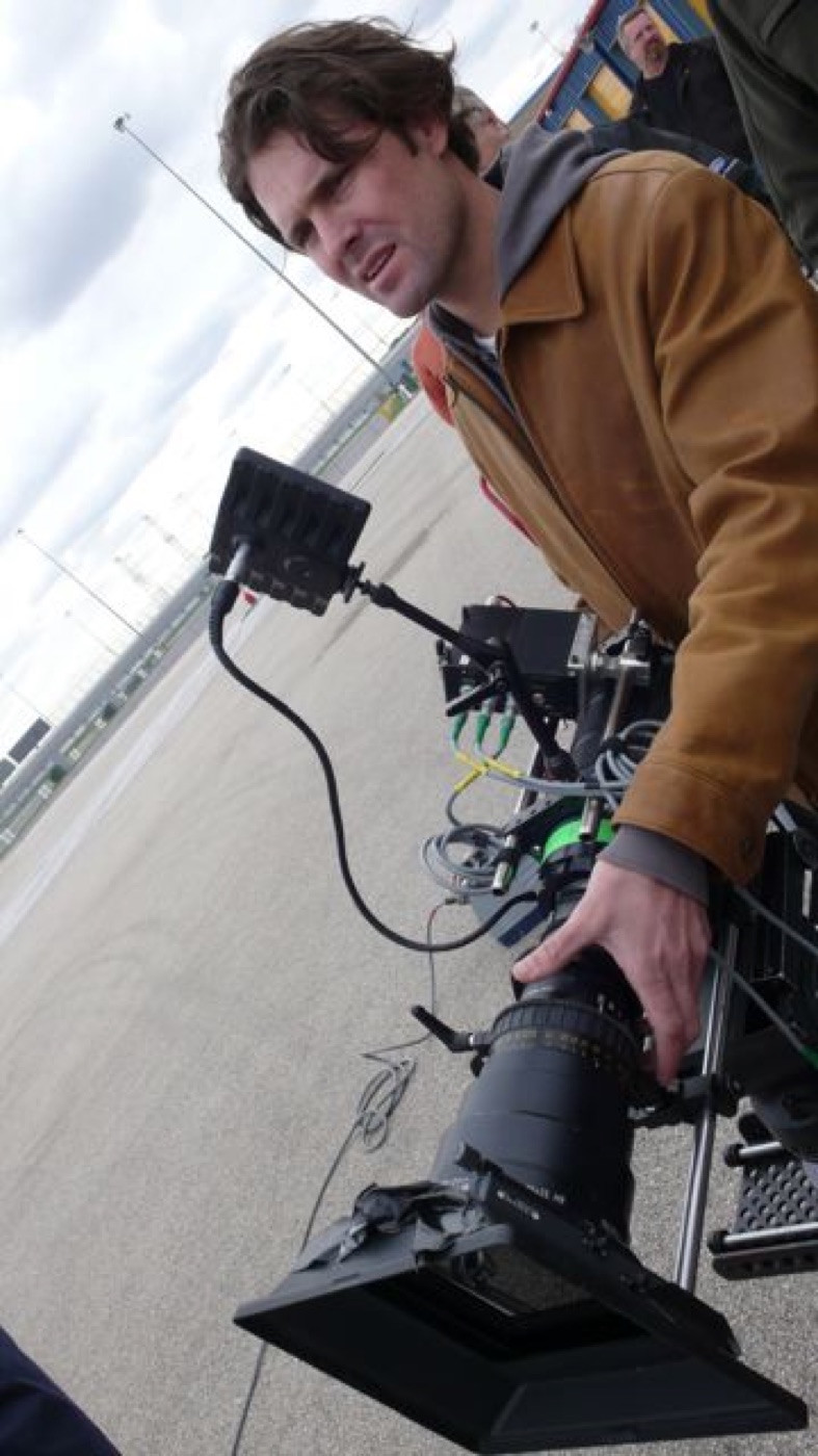 Stanton Barrett operating a camera rig, directing
