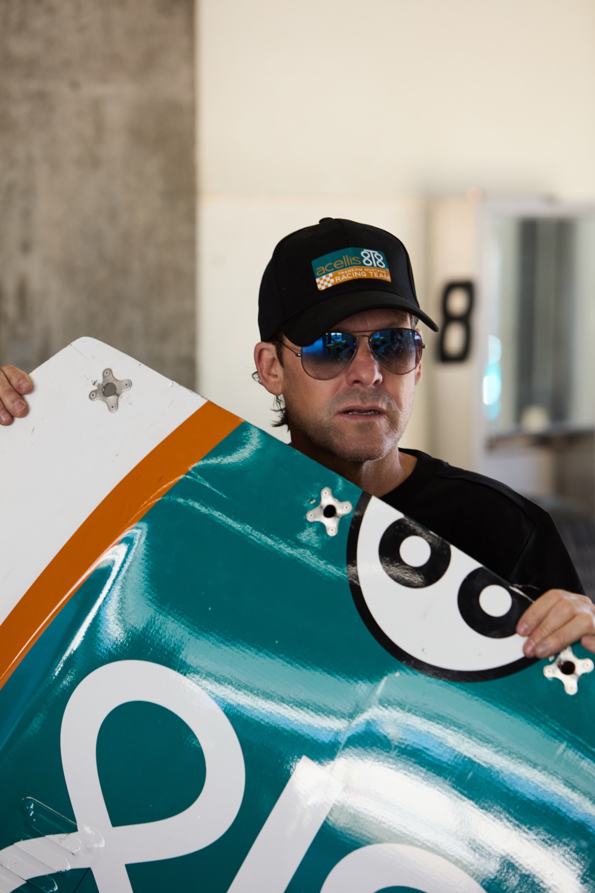 Stanton Barrett beside the 8T8 Mustang