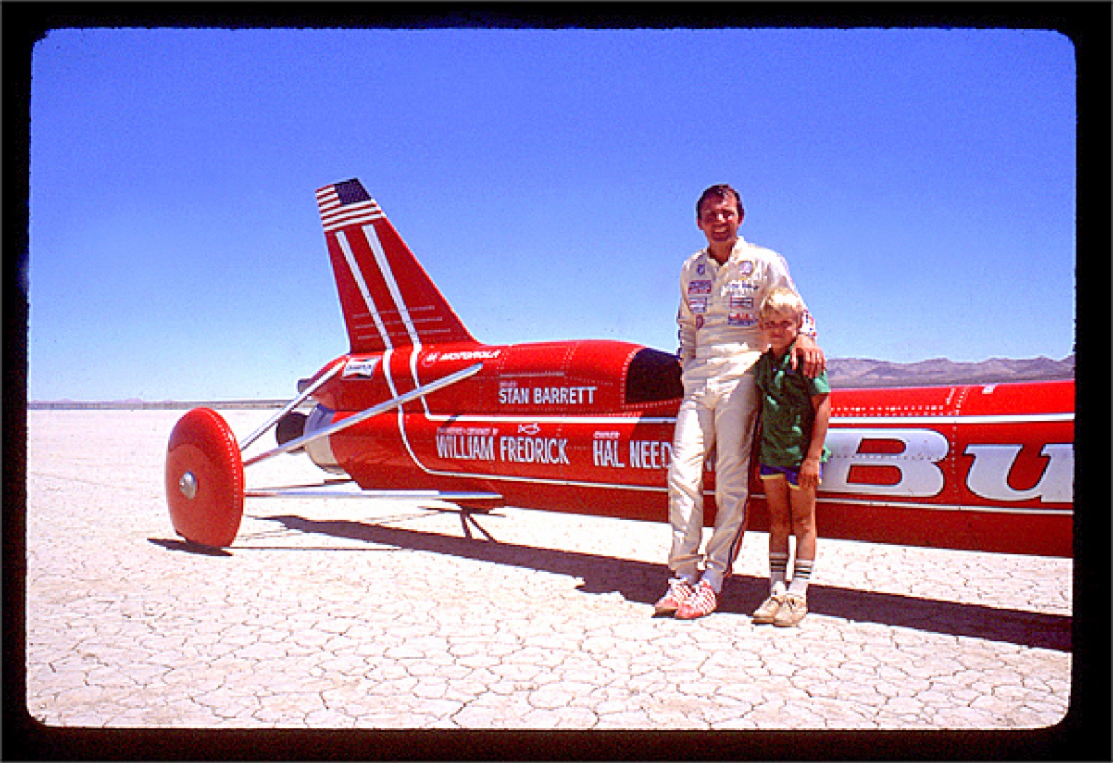 Stan Barrett standing beside the Budweiser Rocket Car