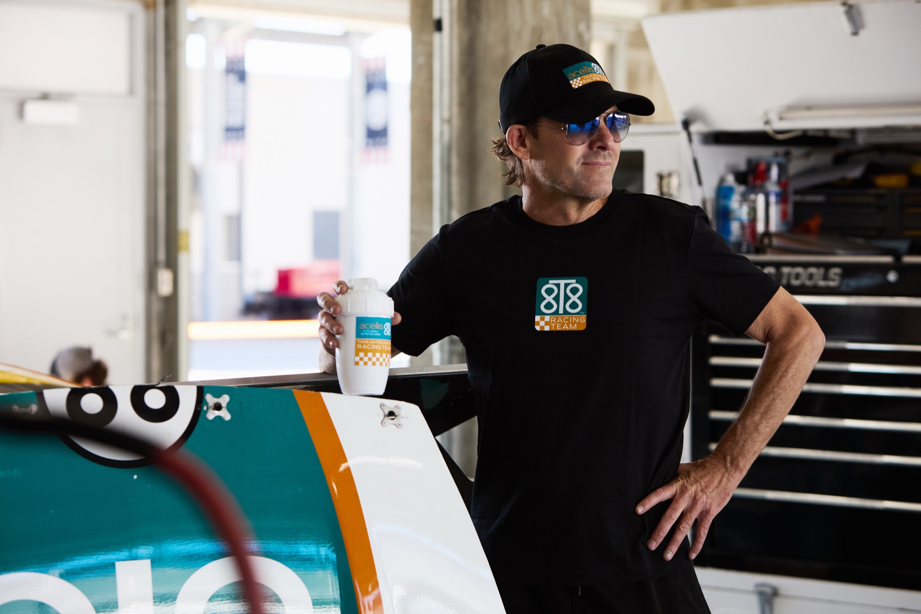 Stanton Barrett in the garage holding an 8T8 energy can