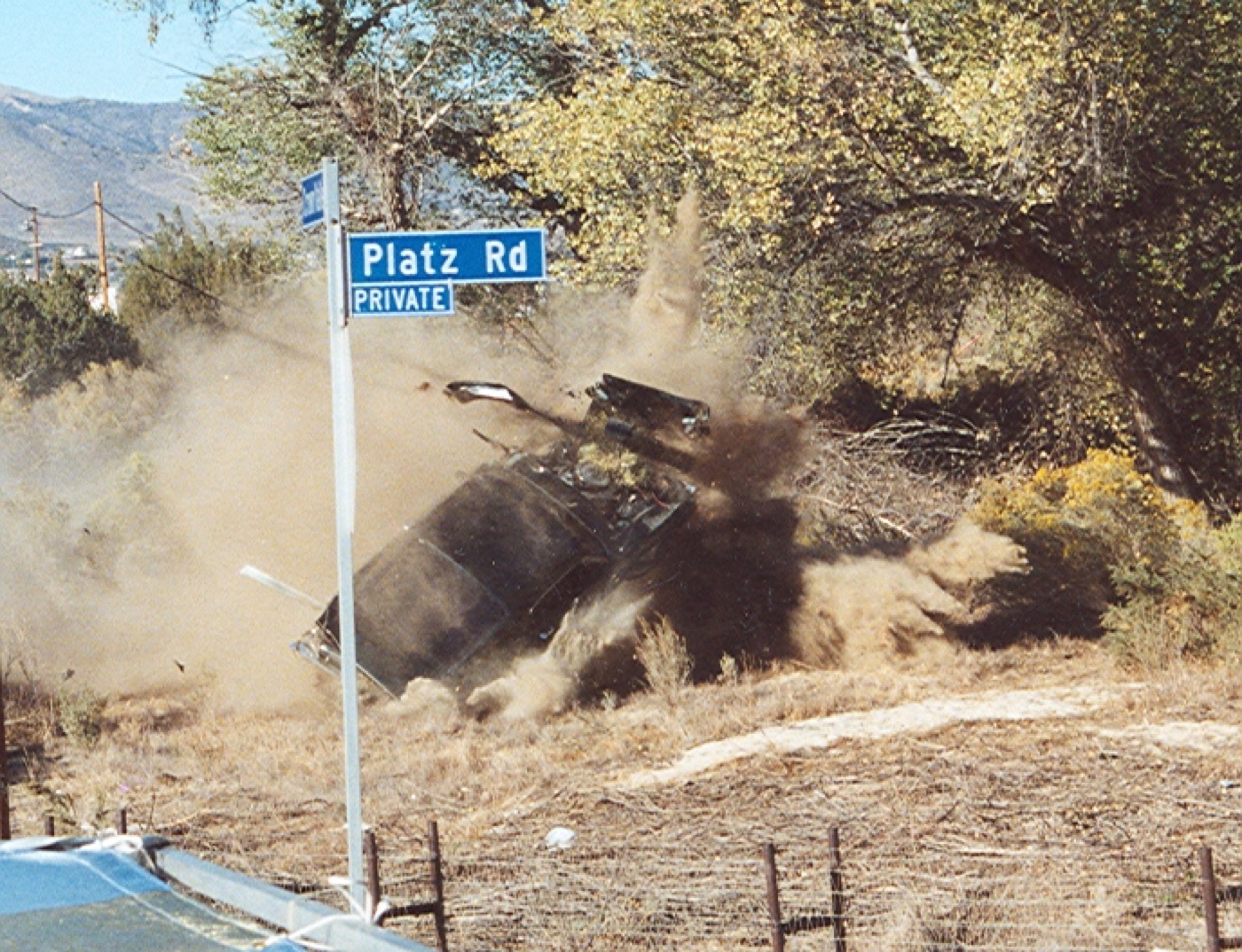 A car crashing through brush in a film stunt